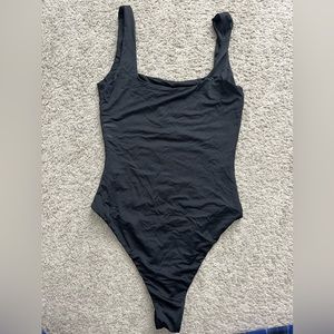 a black bodysuit with a square neck size xs